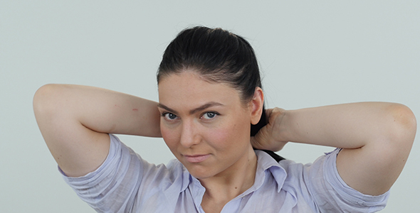 Woman Tying Knot in Hair 