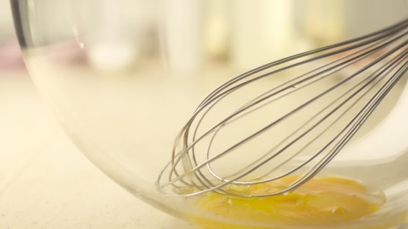 Falling Yolk In To a Glass Bowl 