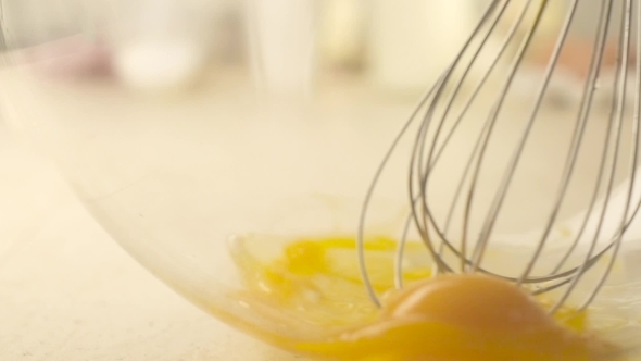 Whisking Eggs In The Glass Bowl