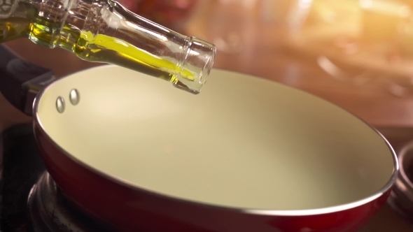 Pouring Mustard Oil Into Frying Pan