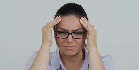 Woman with Glasses and Headache