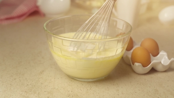 Whisking Egg Yolks With Sugar And Cream 