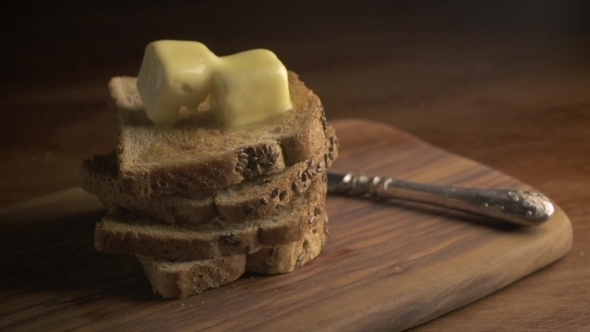 Stack Of Bread Slices And Melting Butter