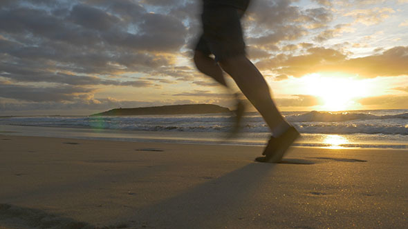 Running Along the Beach at Sunrise