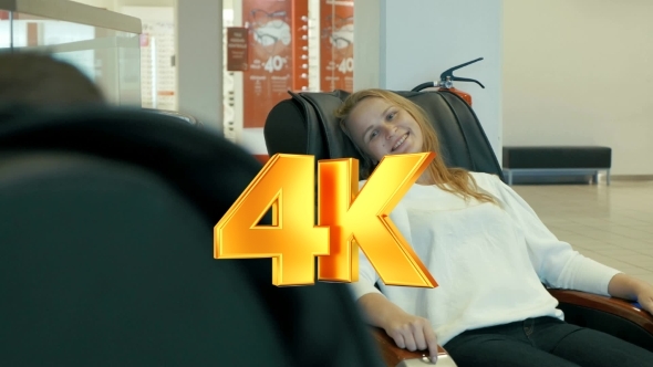 Young Woman Enjoying Massage In Special Arm-chair alt