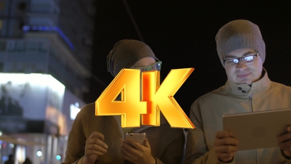 Friends With Gadgets Walking In Tallinn alt