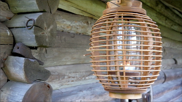 Side Lamp on the Wooden Log House