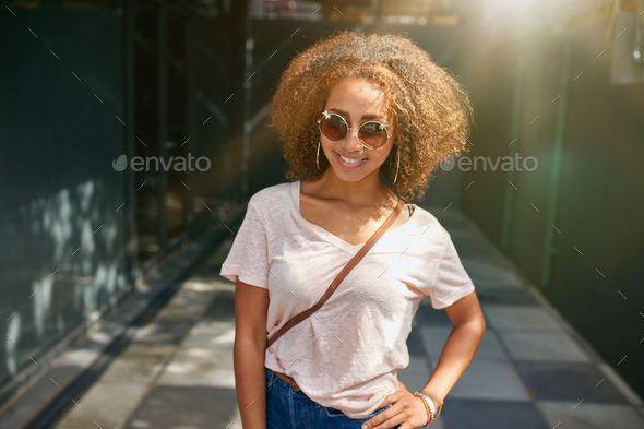 Attractive young woman posing outdoors - Stock Photo - Images