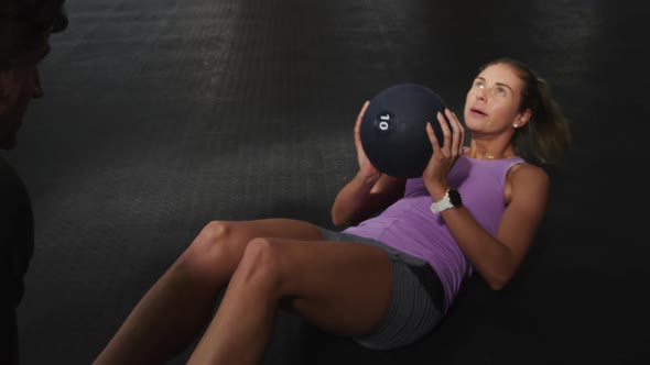 Front view athletic Caucasian friends doing abdominal exercises alt