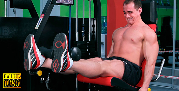 The Man Trains His Legs While Sitting on the Bench