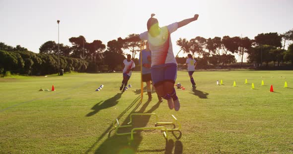 Female soccer team training on soccer field 4k alt