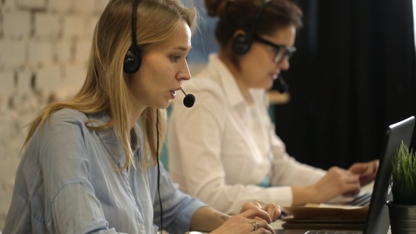 Two Beautiful Businesswoman Working  alt