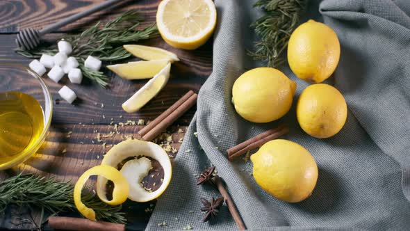 Still Life with Lemons and Cinnamon with Honey on Wooden Table alt