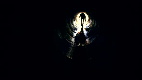 Sportsman with Light Run in Dark Underground Tunnel