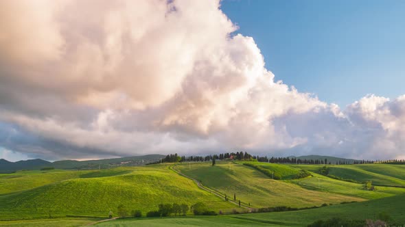 Time lapse: unique green landscape in Volterra region, Tuscany, Italy. Scenic clouds moving by wind. alt