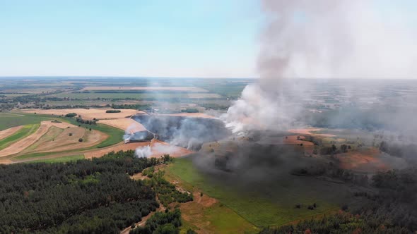 Aerial View of Fire in Wheat Field. Flying Over Smoke Above Agricultural Fields alt