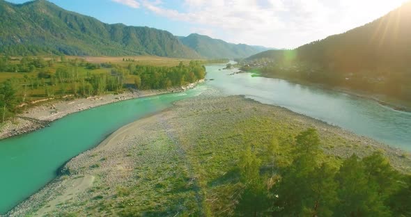 Low Altitude Flight Over Fresh Fast Mountain River with Rocks at Sunny Summer Morning alt