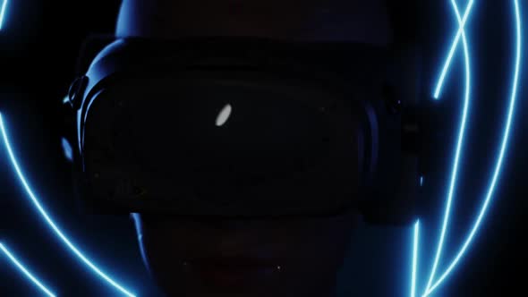 portrait of a girl in a VR helmet. dynamic scene as a girl looks around while in virtual space alt
