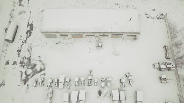 View From a Drone To an Abandoned Snowcovered Vehicle Fleet of Technical Vehicles