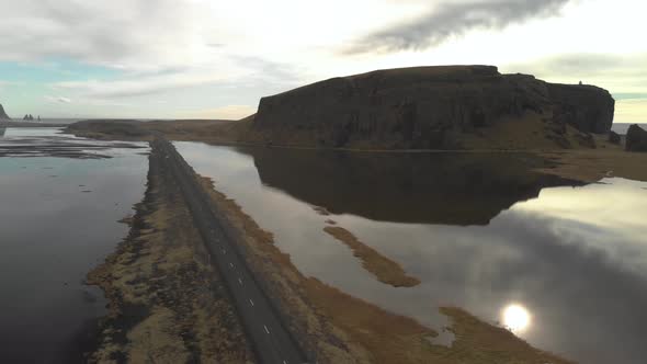 Stunning Aerial Shot of a Coastal Road in Iceland. alt