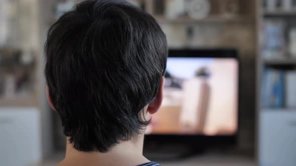 Man Watching TV Home alt