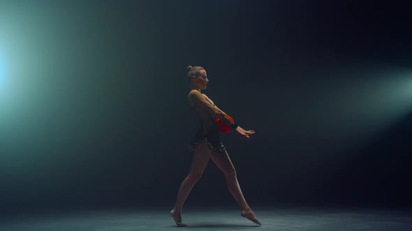 Flexible Woman Performing with Ball alt