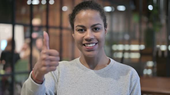 Thumbs Up By Positive African Woman alt