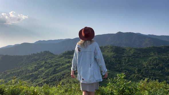 Woman Enjoying Mountain View on Sunrise