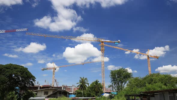4k Time-lapse of Industrial construction crane with the blue sky background alt