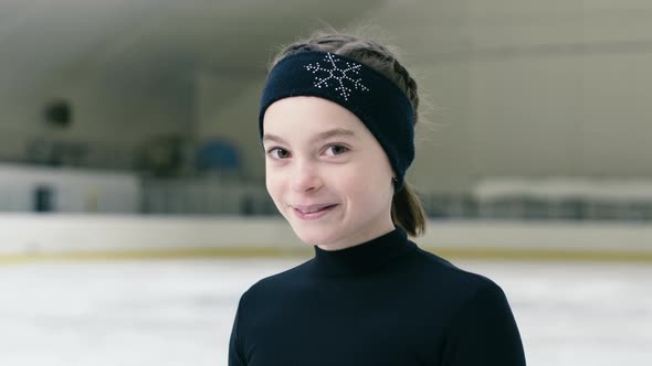 Portrait of happy figure skating girl