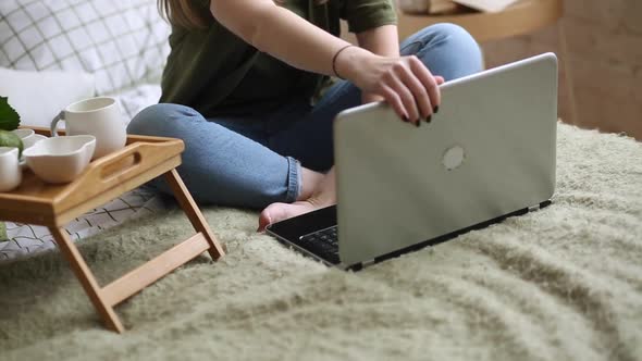 A Young Freelance Woman Who Has a Video Call with a Colleague Working Online From Home in a Cozy alt