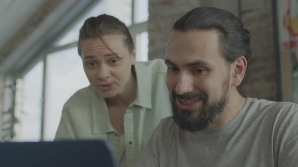 Friends are Working Together on a Common Project Smiling and Laughing alt