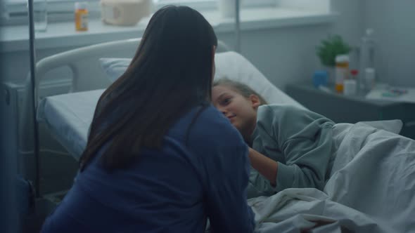 Recovering Child Lying in Bed Near Caring Mother Pediatric Hospital Unit alt