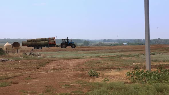 Tractor Works in Field