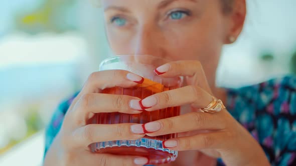 Woman Drinking Alcohol Negroni Cocktail In Bar. Summer Holiday Vacation Travel On Sea. alt