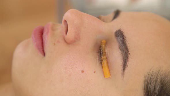 A Beautiful Girl in a Beauty Salon Does a Lamination Lashes