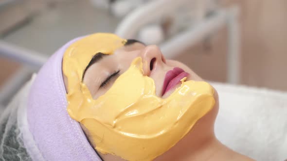 Young woman gets beauty facial injections in salon. Aesthetic cosmetology. alt