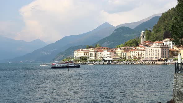Ferry Boat Arrives at Beautiful Tourist Town of Bellagio, Lake Como, Italy alt