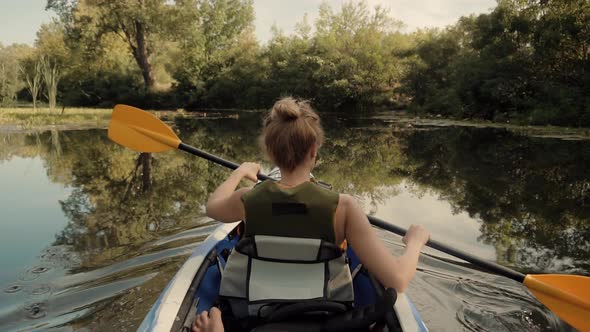 Kayak Oar Paddle Rowing At Sunrise On Vacation.Paddle Rowing On Quiet River At Sunset In Slow Motion alt