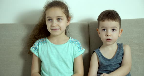 Children Brother and Sister Watching TV alt