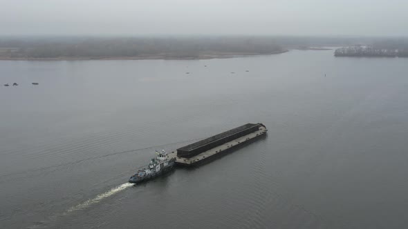 The Barge Floats on the River