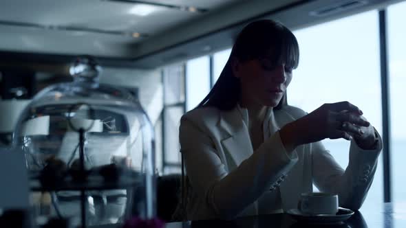 Depressed Woman Thinking at Cafe Closeup alt