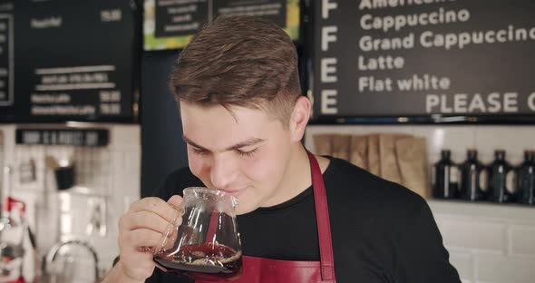 The Barista Smells the Coffee He Made Enjoys It in a Modern Cafe V 60 alt