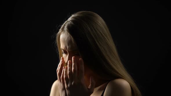 Frightened Lady Showing No Gesture and Hiding Face Behind Palms, Women Rights alt