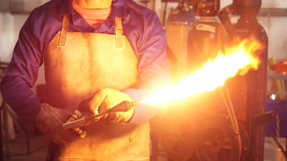 Welder working in workshop alt