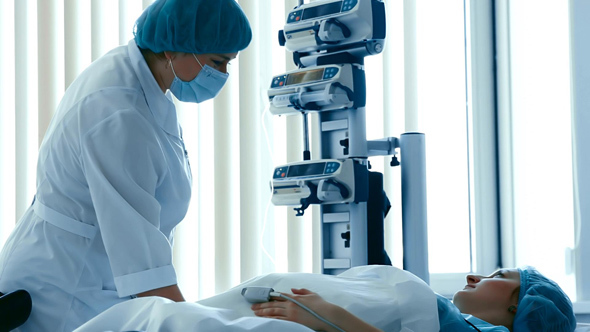 Doctor Checks a Pregnant Woman before Child Birth