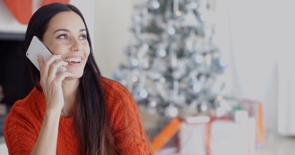 Pretty Young Woman Chatting On Her Mobile alt