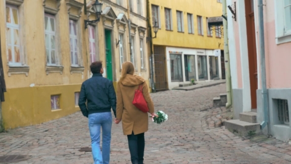 Loving Couple Having a Walk In Old Empty Street alt