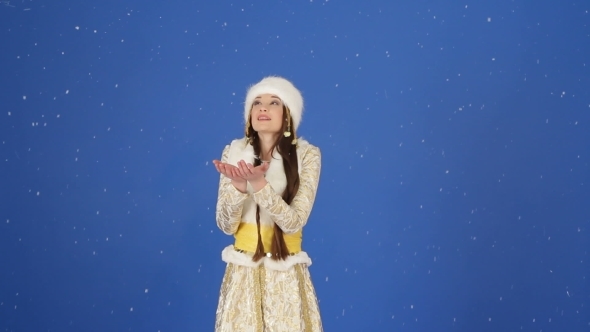 Happy Snow Maiden Enjoying Falling Snow In Studio