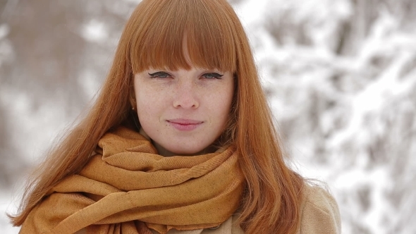 Beautiful Young Girl Looking At Camera In Winter